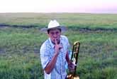 Farmer Serenading The Cattle With His Trombone