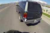 Motorcyclist Saves Cup From Bumper Of Passing SUV