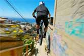Racing Drone Follows Urban Mountain Biker