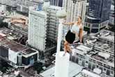 Woman Climbing A Tower In A Mini Skirt